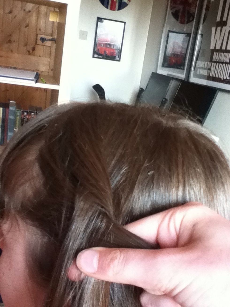 Start braiding. Remember, this is a Dutch braid, so you put the pieces of hair UNDER each other, rather than over each other like you do for a French braid.