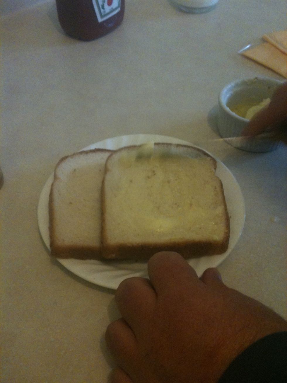 Start buttering the bread. Only do one side.