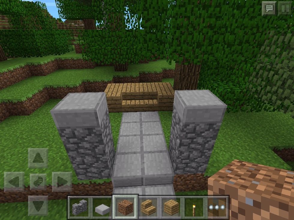 Start by adding path two stone block on each side two blocks tall plus slab and put two stairs at the end of the path and 1 block on each side