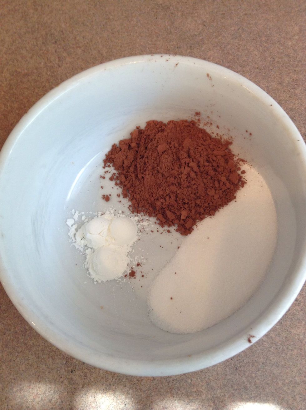 Start by adding your cornstarch, cocoa powder, and sugar to a bowl.