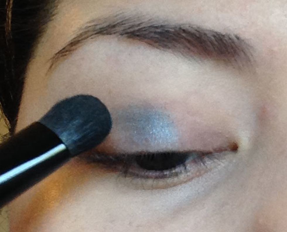 Start by applying the shade Aqua (metallic aquamarine color) on to your lid. I am trying to stay on my lid and not go up into my crease but I don't have that much space so do your best!