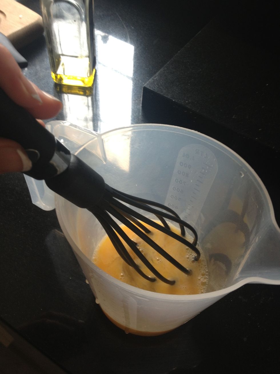 Start by beating your eggs. You can add a pinch or salt and pepper here, if you like.