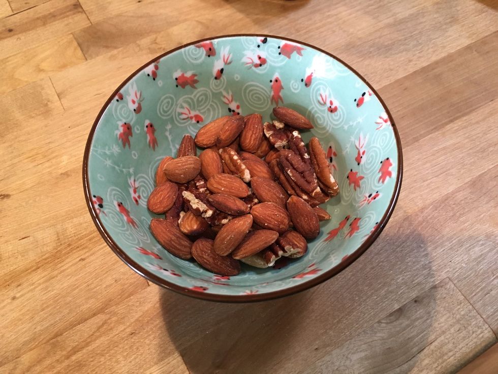 Start by coarsely chopping nuts. We used almonds and pecans.