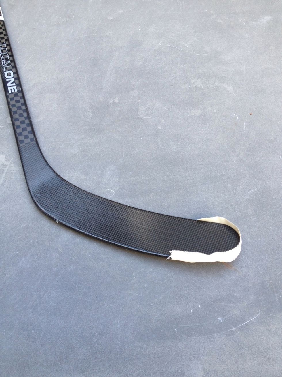 Start by covering just the toe of the blade with a short strip of tape.