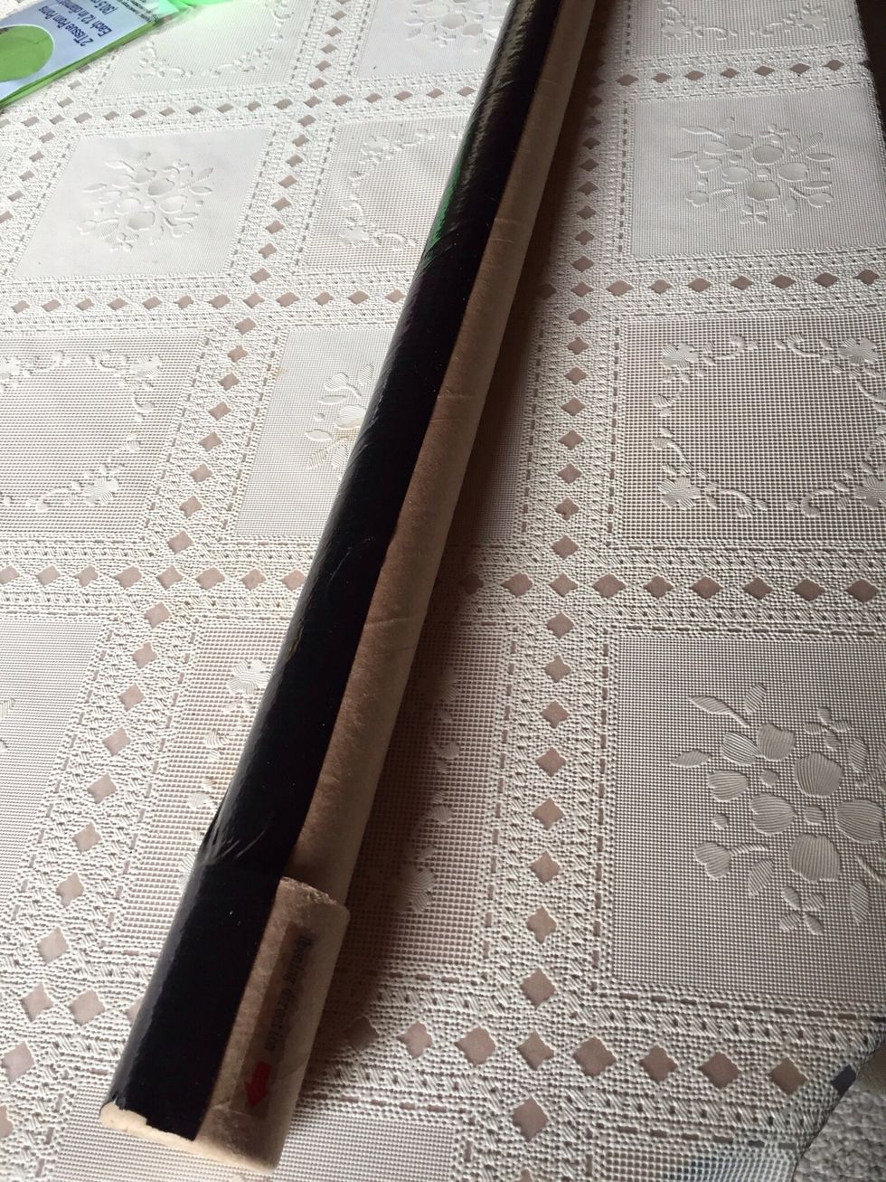Start by covering the tube with duct tape. I used black for base color. Three long strips covered up the tube.