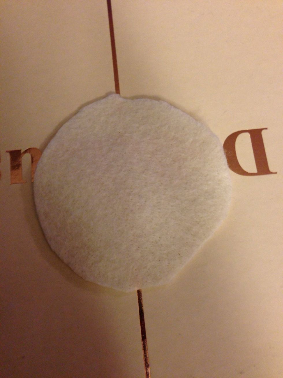 Start by cutting a piece of felt into a circle. You want this to be about half the size of your bow circle size.