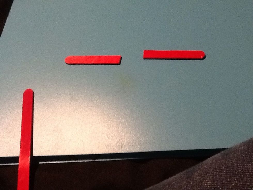 Start by cutting one of your sticks in half with your scissors this might take some muscle