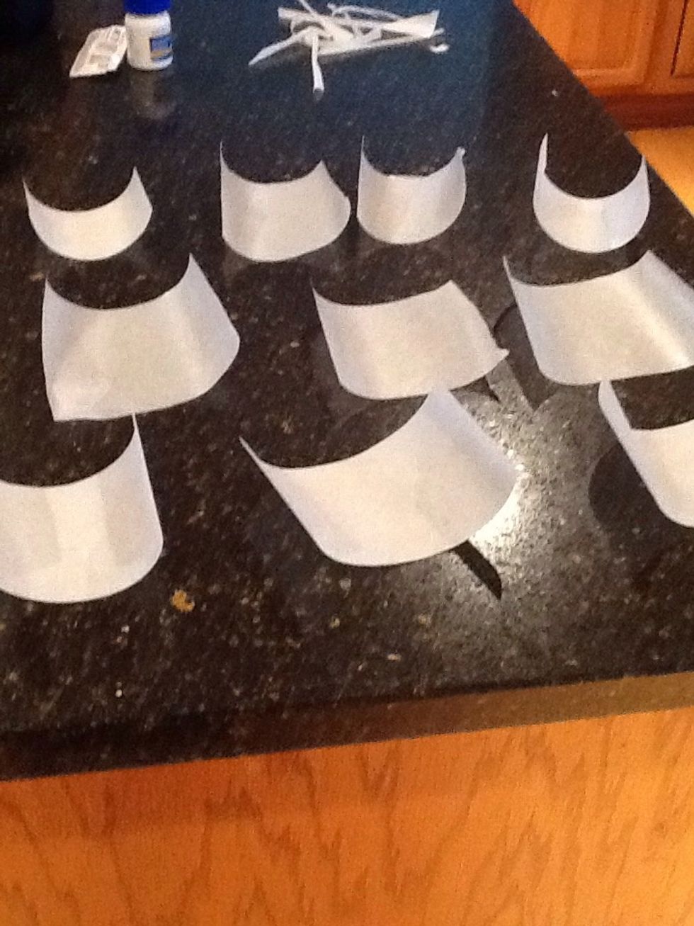 Start by cutting out little pieces of your wax/parchment paper