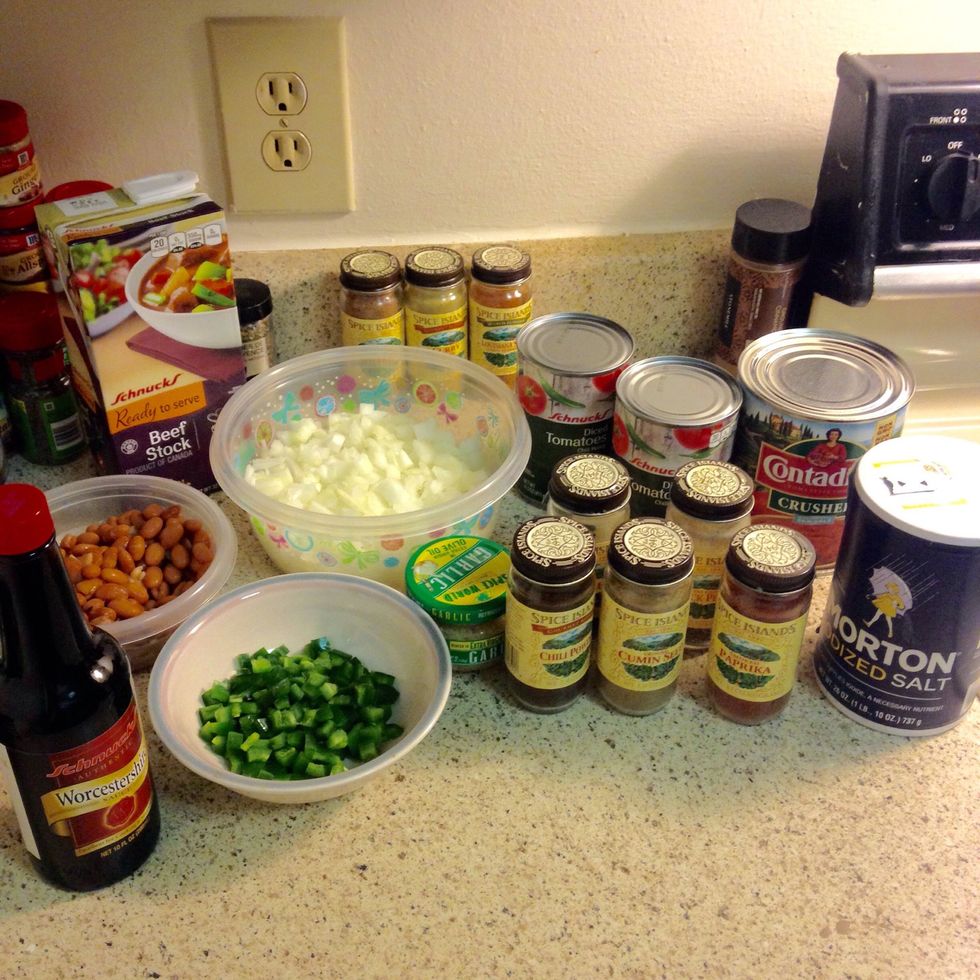 Start by dicing your onion and poblanos, draining your beans and diced tomato, and mincing your garlic (or be lazy and get your jarred garlic :p). Also a good idea to measure out spices and liquids.