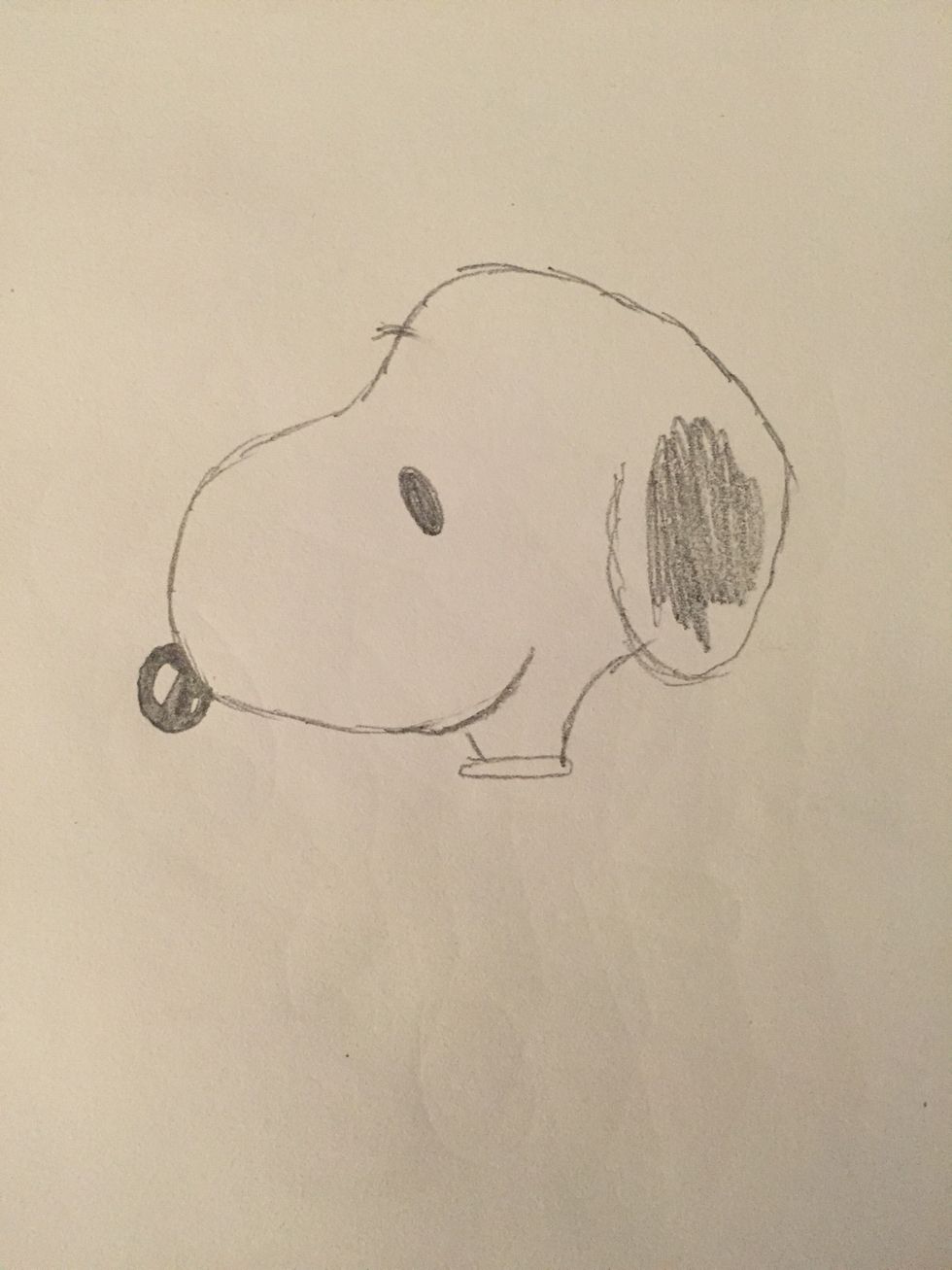 Start by drawing Snoopy's head. Don't color in his whole ear- just a little scribble. Snoopy's a beagle, so he has different colored spots.