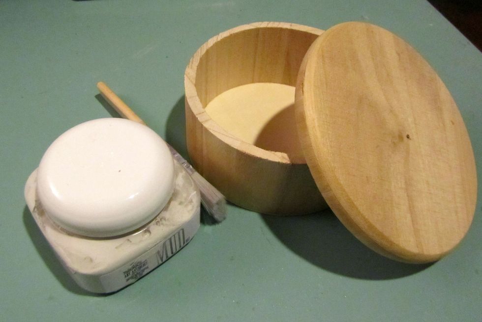 Start by drilling a small hole in the lid of your wood box.