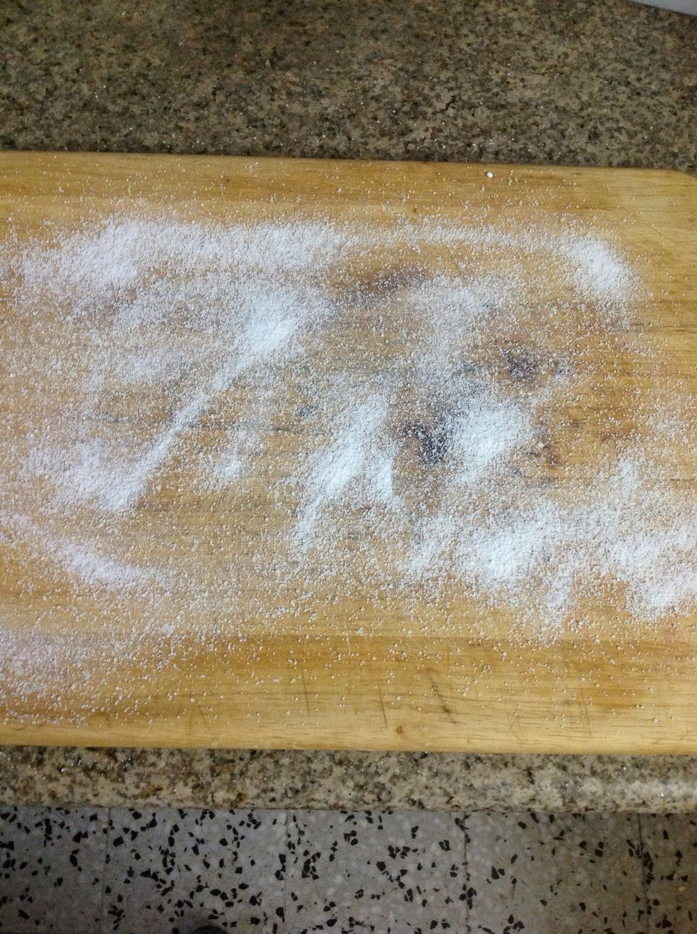 Start by dusting your work area with sugar (not flour); about 1-2 Tablespoons.