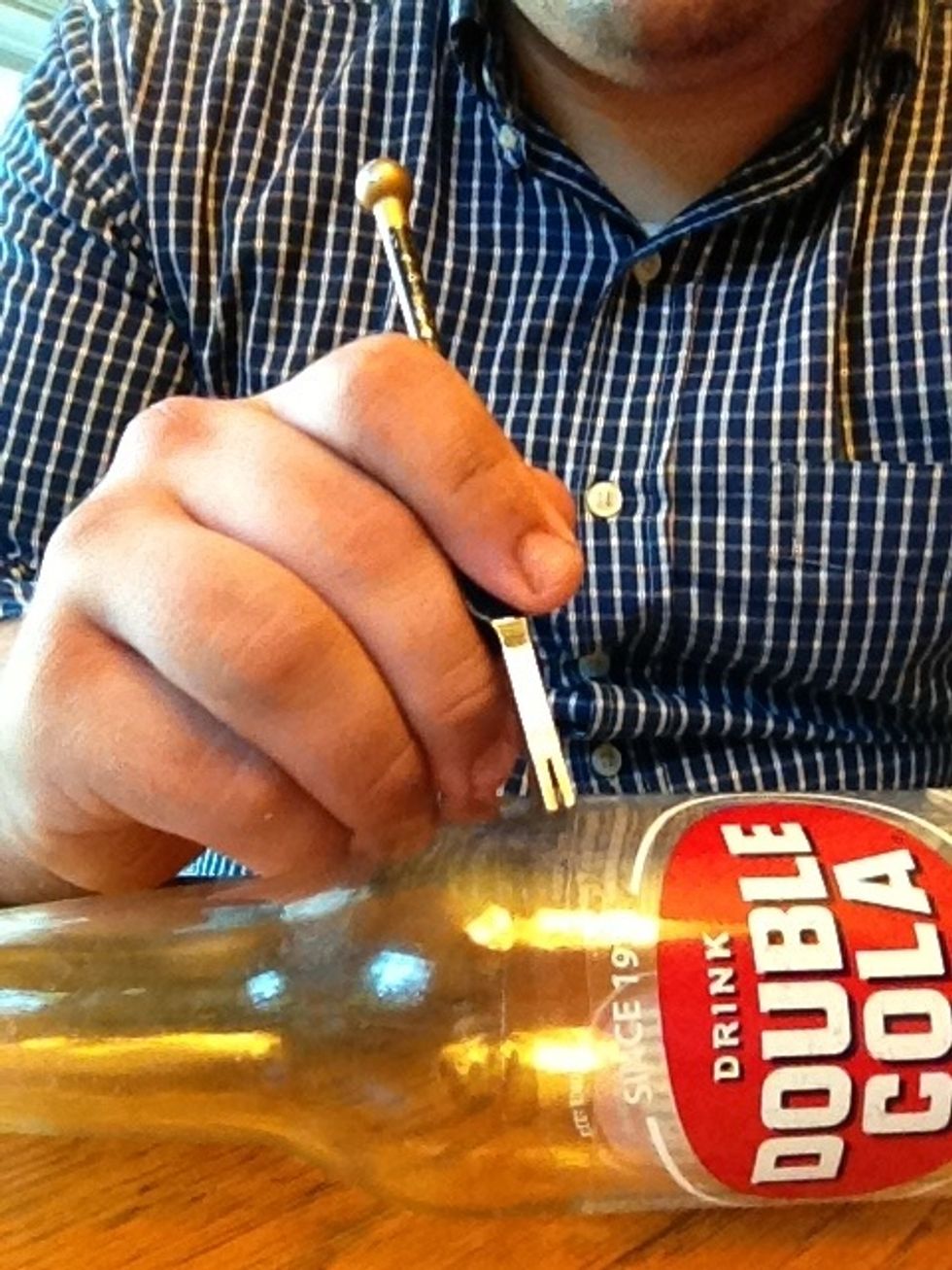 Start by etching a circle around the bottle where you want it cut. This is the hardest part