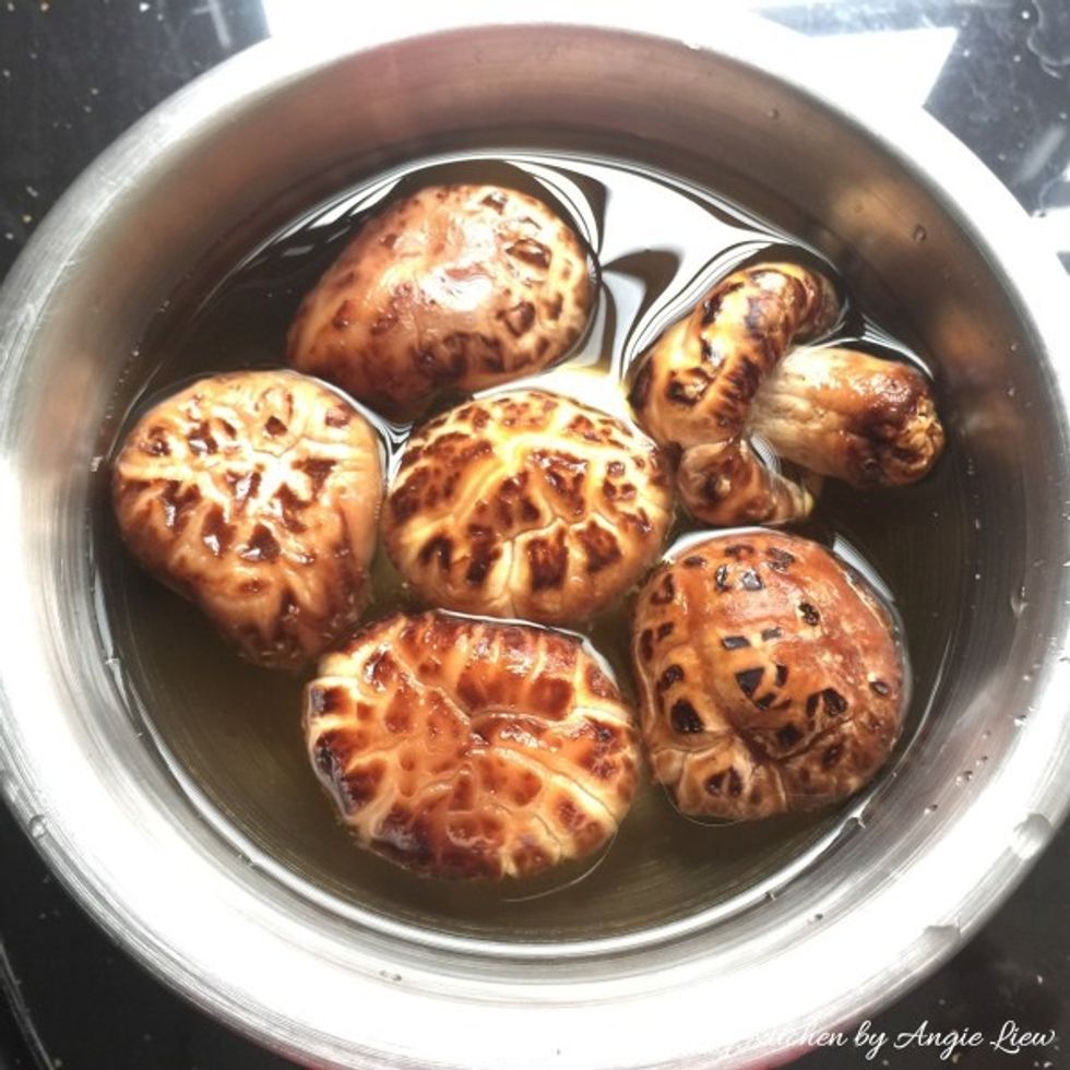 Start by first soaking dried shiitake mushrooms in cold water till soft, about 1 hour.