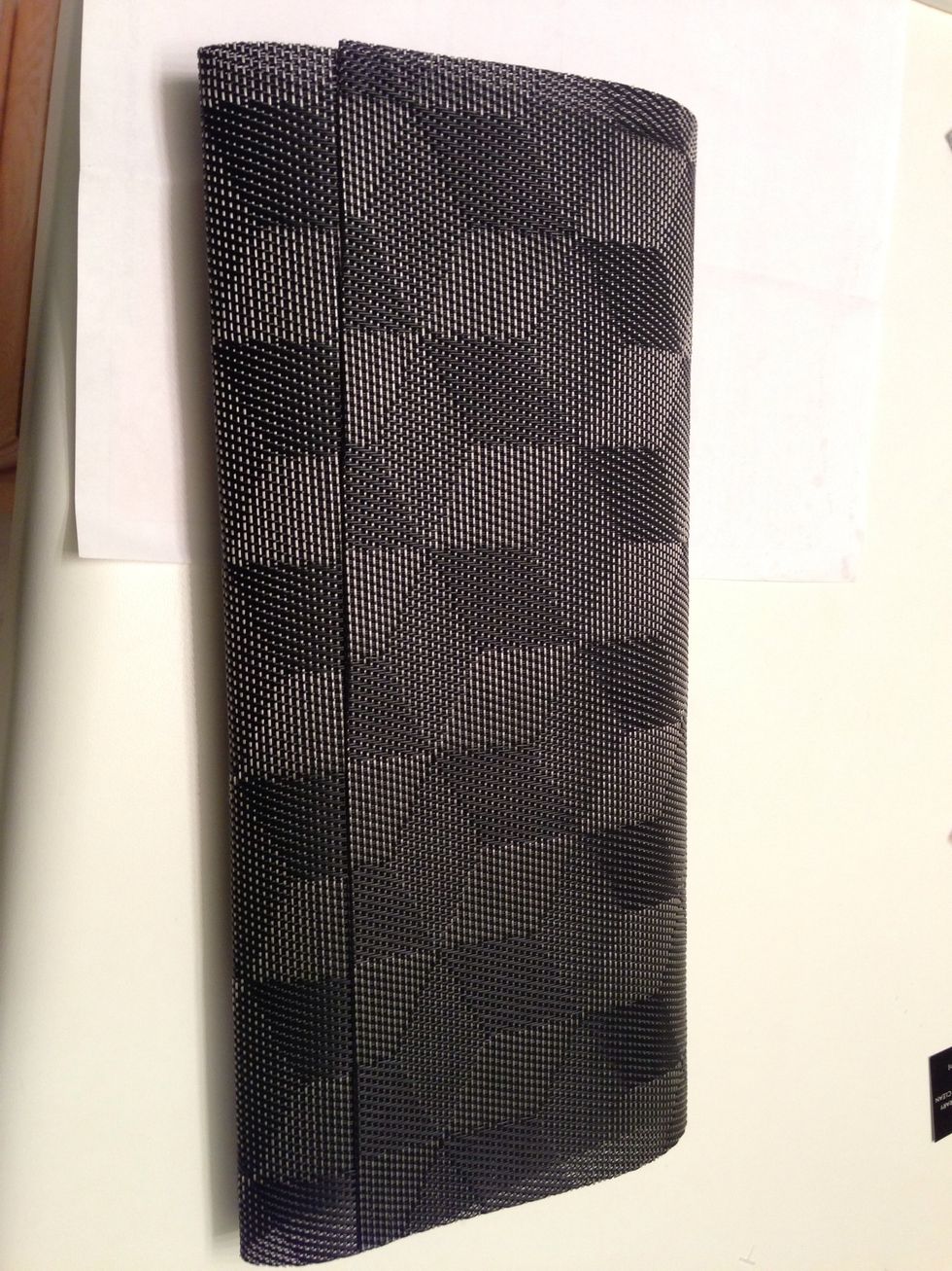Start by folding the mat into thirds, placing the flap where you want it to fall. Press down on each fold to create a crease to know where to apply the glue.