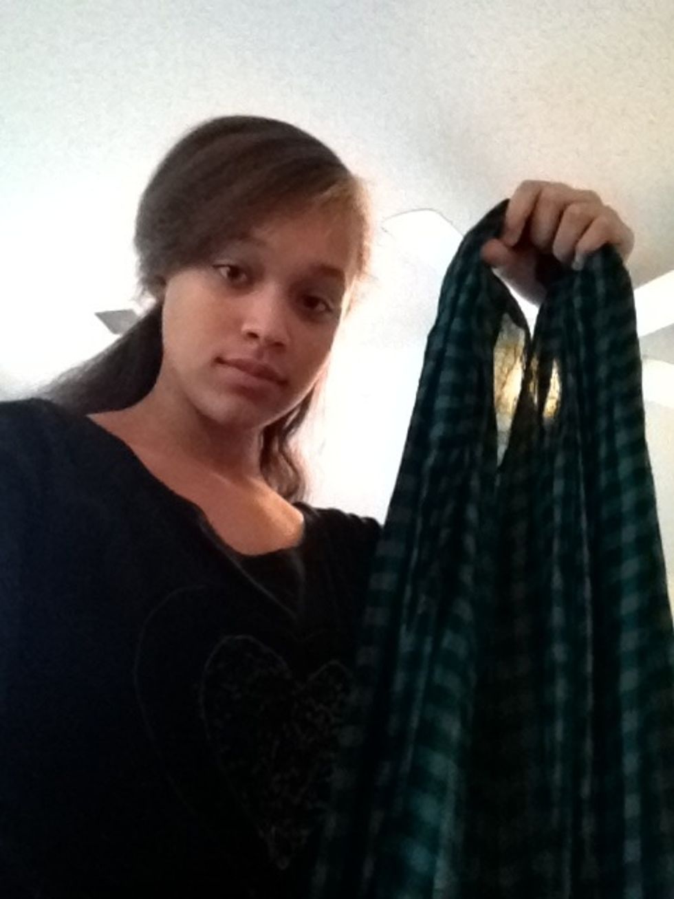 Start by folding your scarf in half