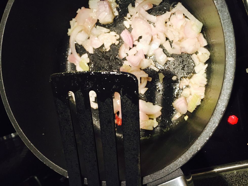 Start by frying the shallot on medium high heat until golden
