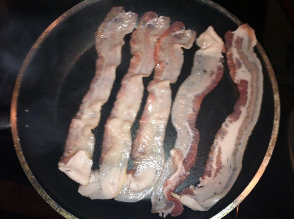 Start by frying your bacon , make sure to save some of the bacon grease.