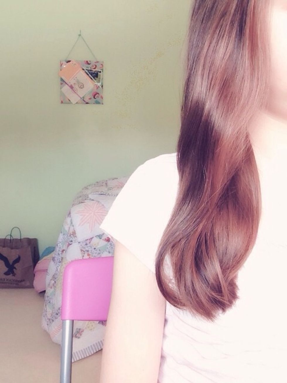 Start by gathering all of your hair to one side