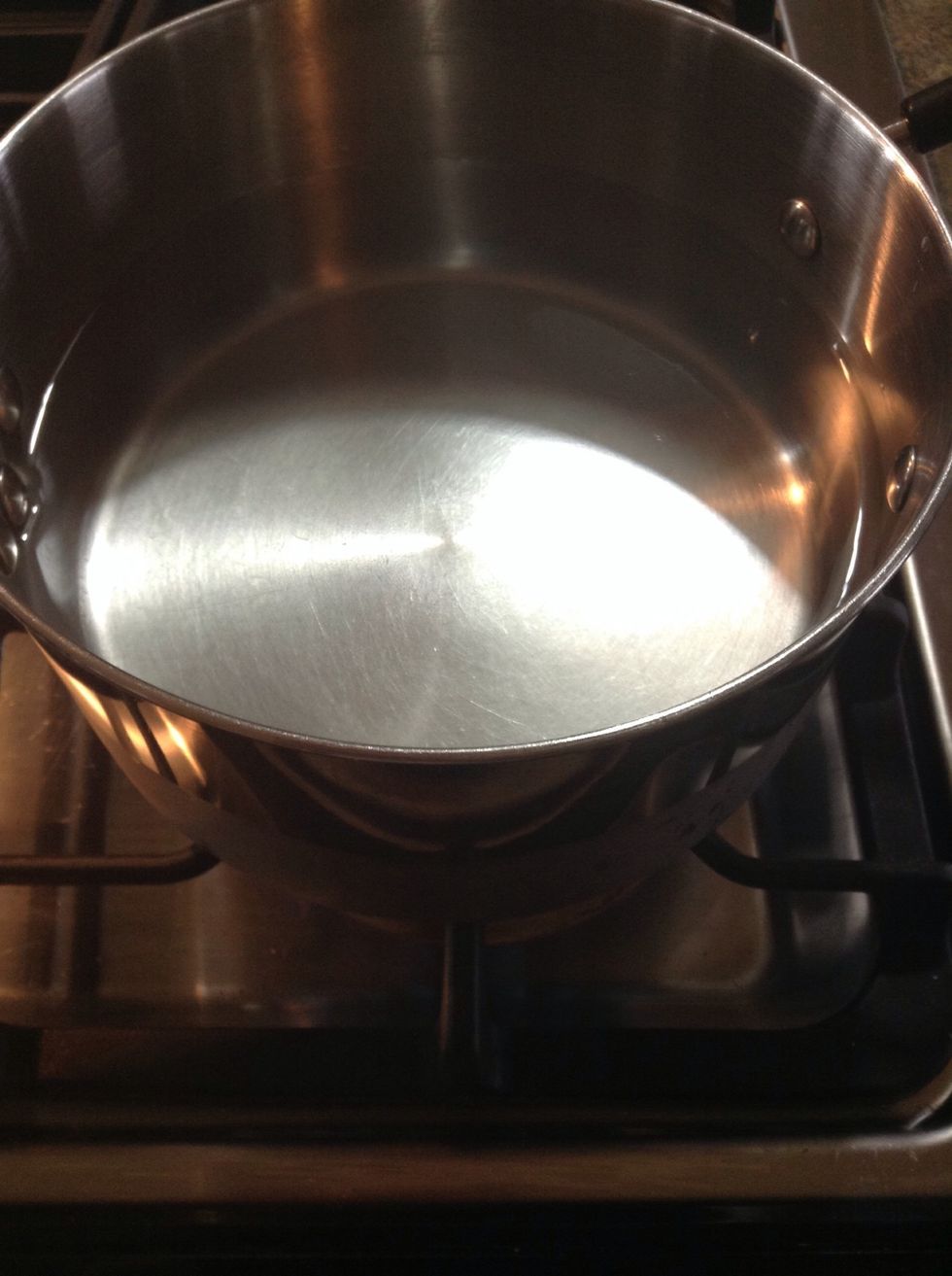 Start by heating a pot of water on high