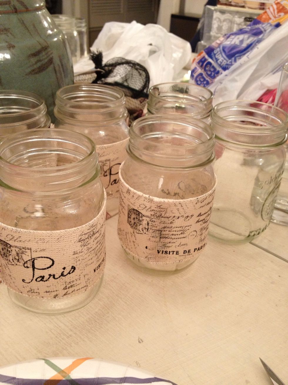 Start by hot gluing a nice ribbon or burlap to a clean mason jar. You can find mason jars at garage sales, thrift stores or even brand new at grocery store. But I'm doing this really cheap!