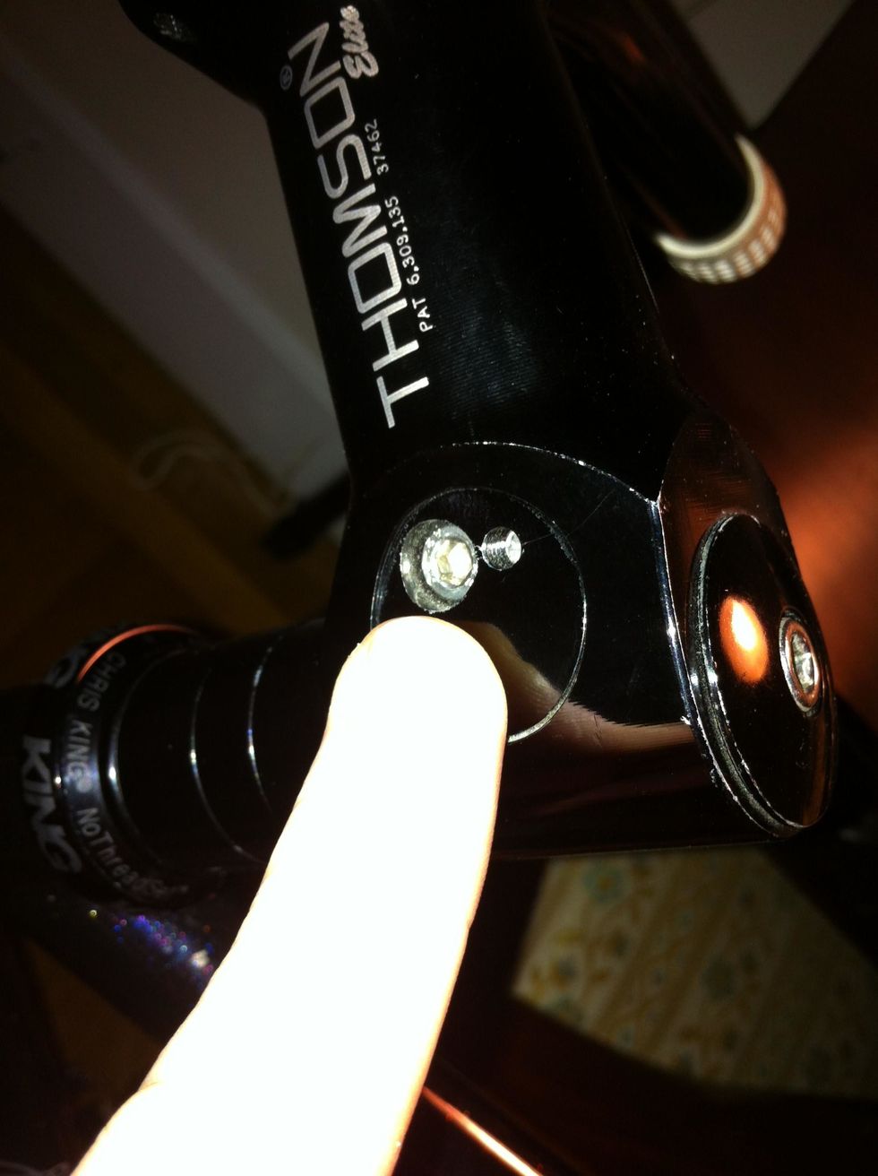 start by loosening the side bolts on the stem. always start by loosening these first as not to crush your star bolt within the fork when you loosen the stem cap bolt. don't remove the bolts.