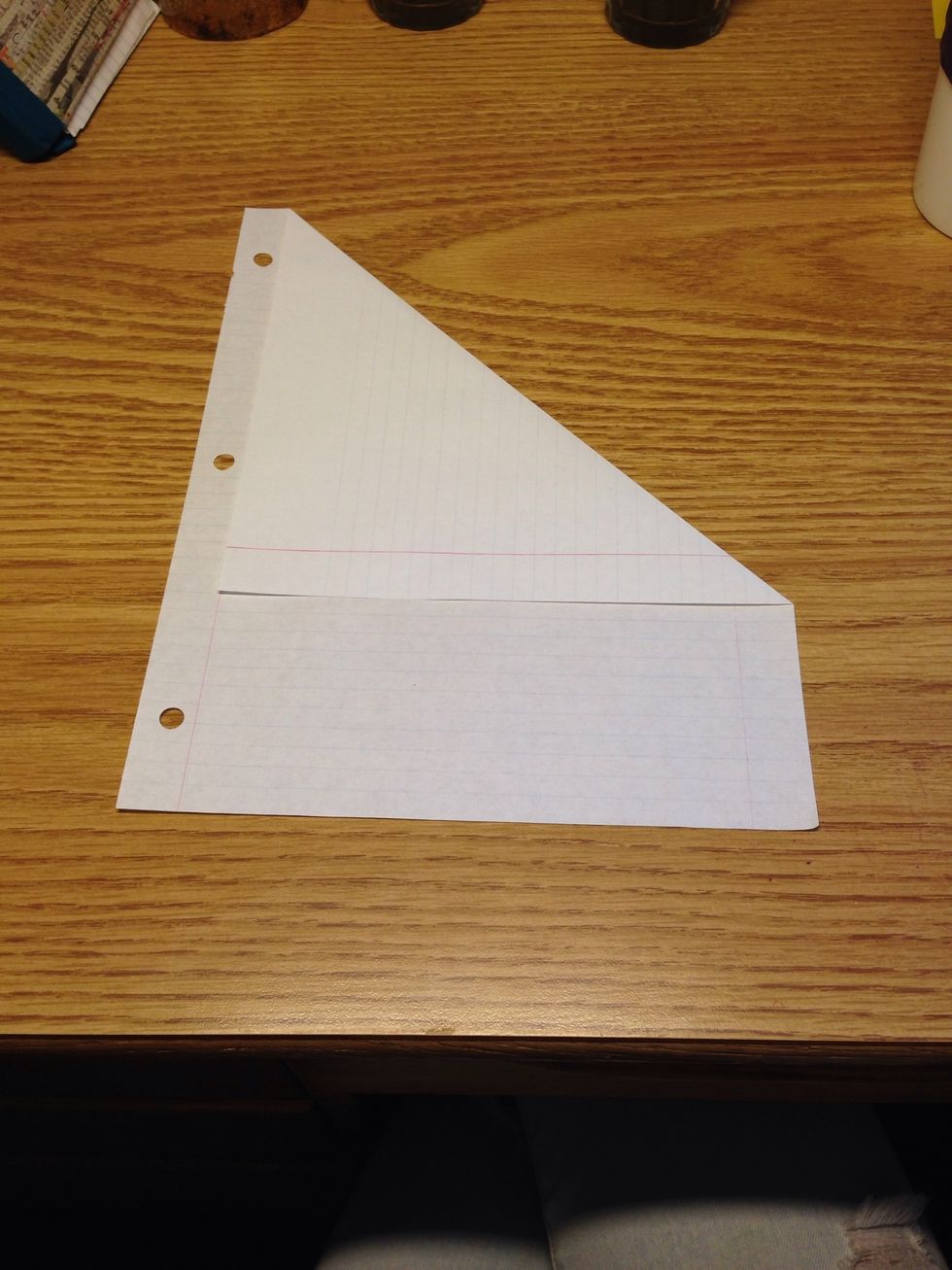 Start by making a square piece of paper. To make the square, fold one corner of the paper over to the adjacent side. Then cut around the edges.
