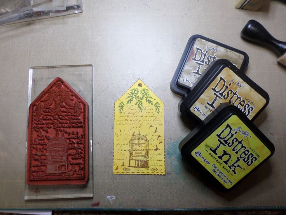 Start by making your tag.  I colored the background with the yellow inks.  Then I inked my stamp with brown ink, except for the branches, which I colored directly to the stamp with green marker.