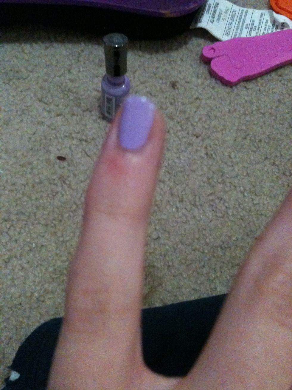 Start by painting one line down the middle of your nail