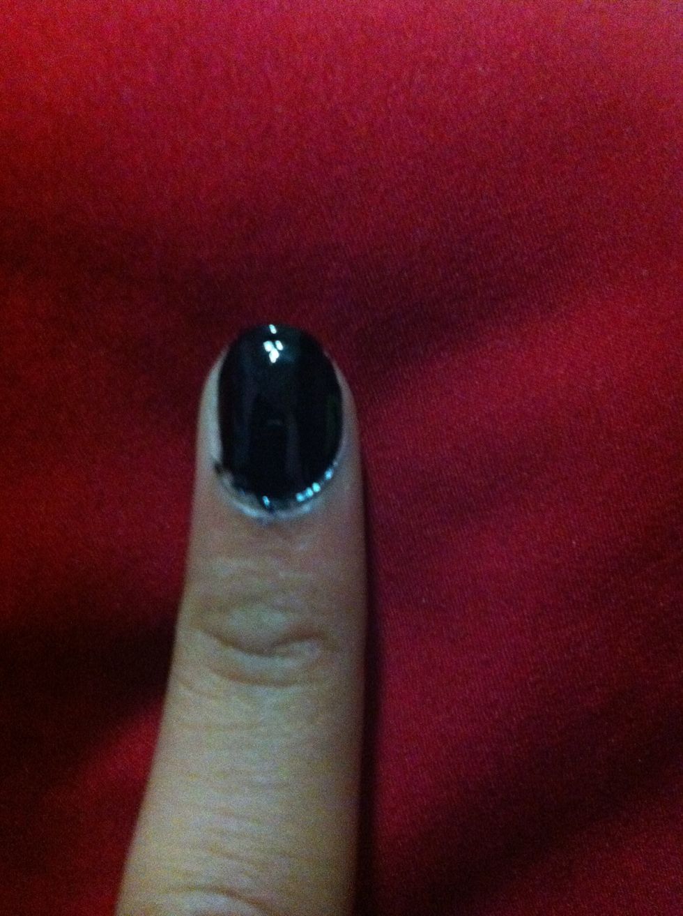 Start by painting your nail black