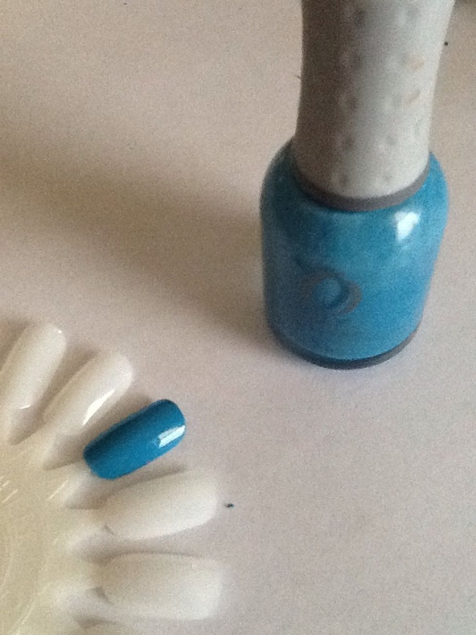 Start by painting your nails a light blue. If you are painting directly on your nails, make sure you use a base coat first to protect your nails.