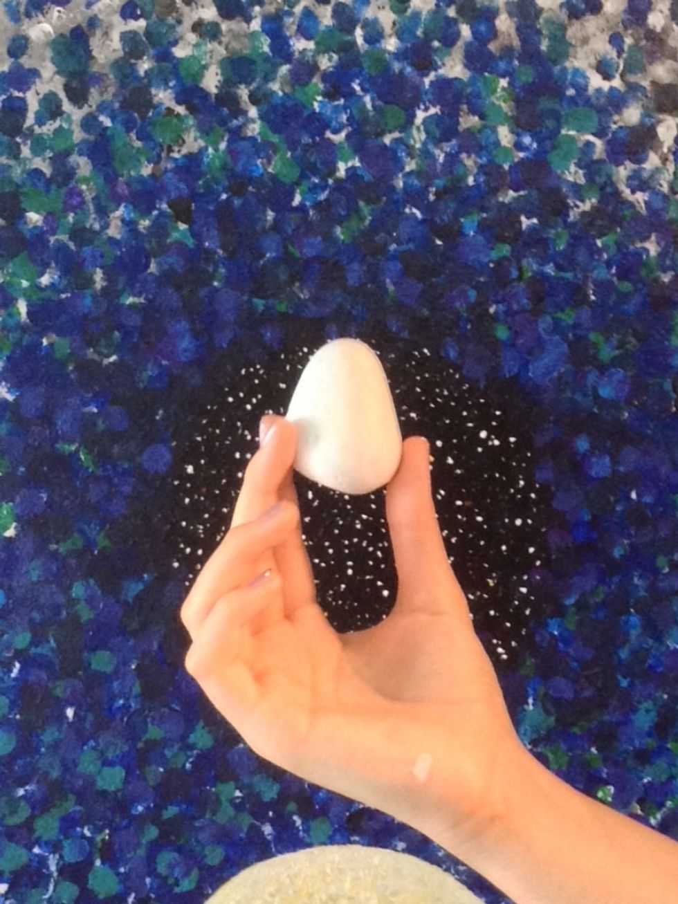 Start by painting your rock completely white. This is a base color for the minion and will make the other colors stand out.