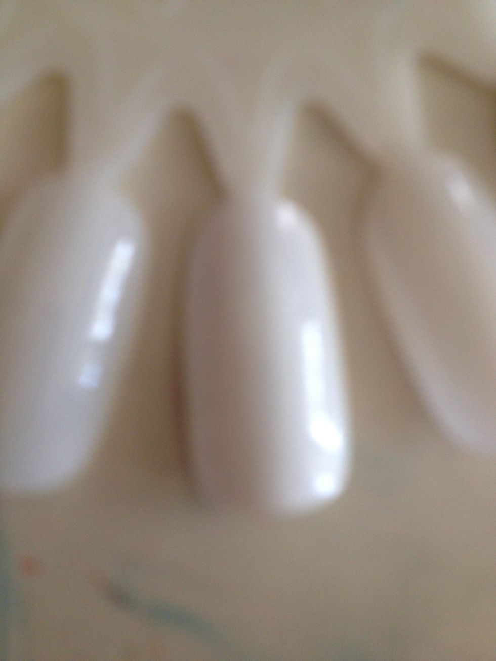 start by painting your whole nail white to make your base coat show up better