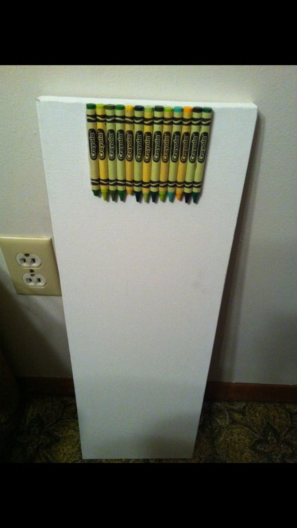 Start by picking the color crayons you want to use and Glue them into your canvas. **note the number of crayons will vary, it just depends on how big your canvas is, you can go edge to edge with them.