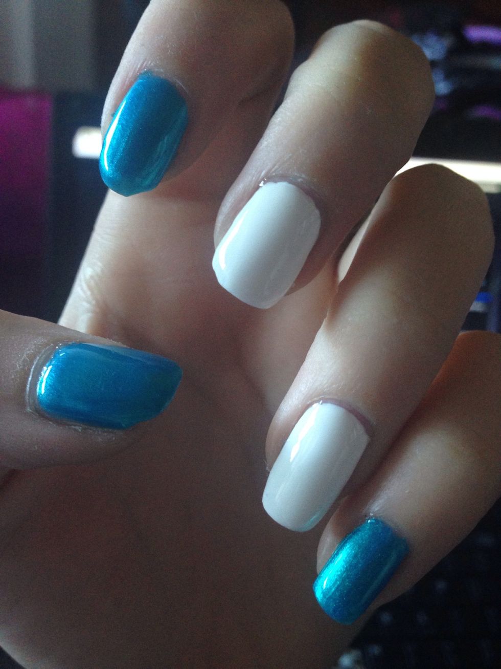 Start by picking which nails will have the design and which will be solid. Paint accents white and solids blue (or whatever color you've picked)