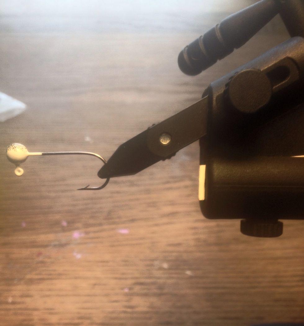 Start by placing the jig in the vice. And clamping it down so it is secure.