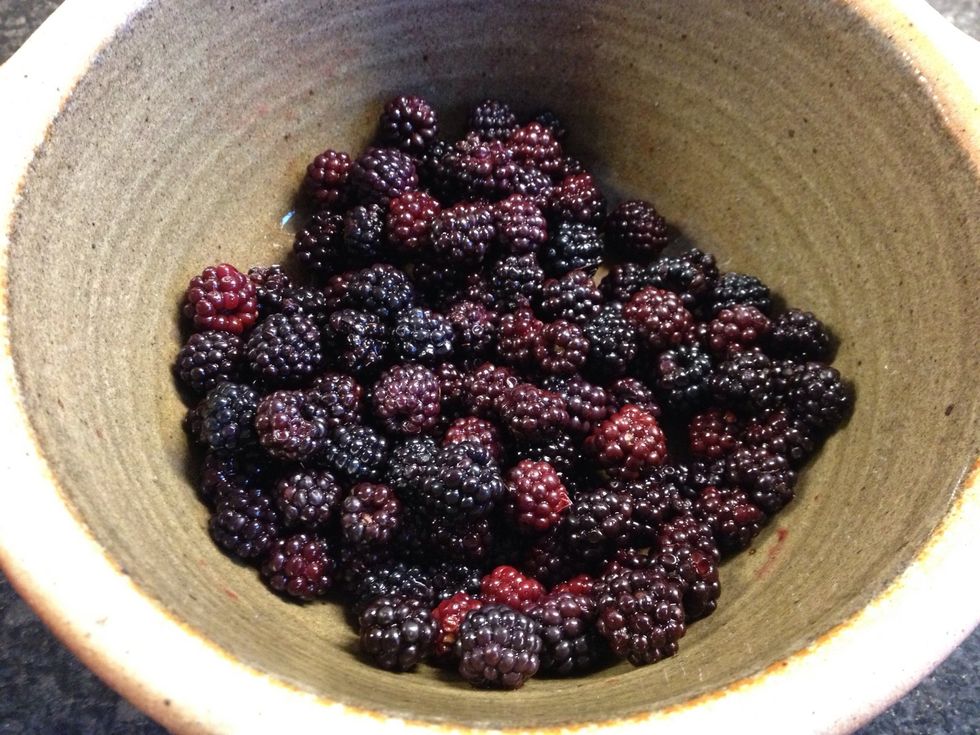 Start by placing your fruit in the bottom of an oven bowl dish. I chose blackberries and apples