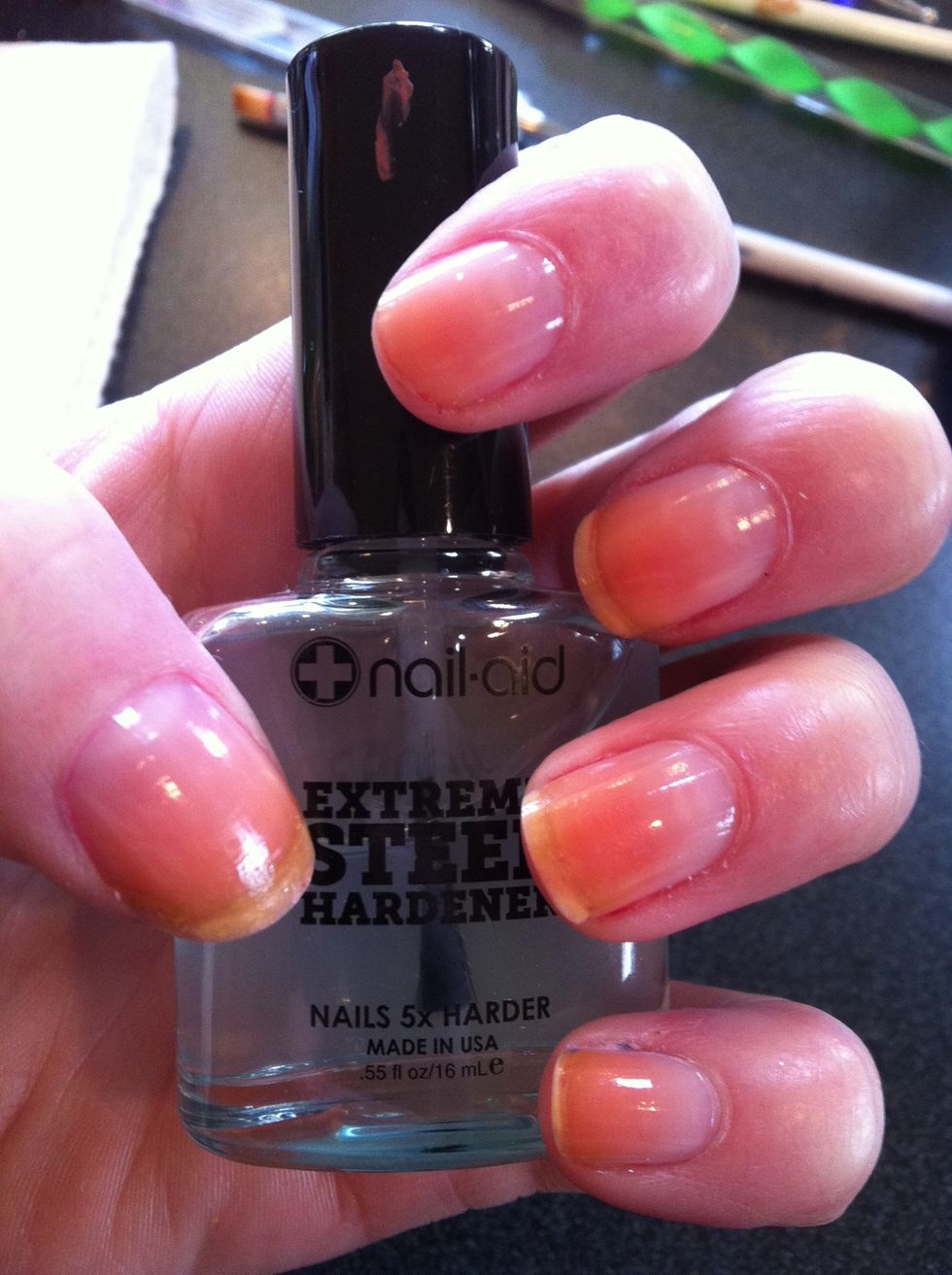 Start by priming your nails with a base coat. I usually use a nail strengthener.