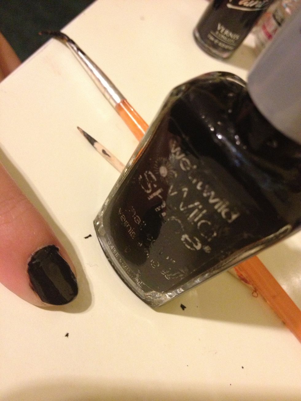 Start by pushing all cuticles back & painting your nails black & your ring finger white(optional) . Any touch-ups you can fix later with a q-tip and nail polish remover.