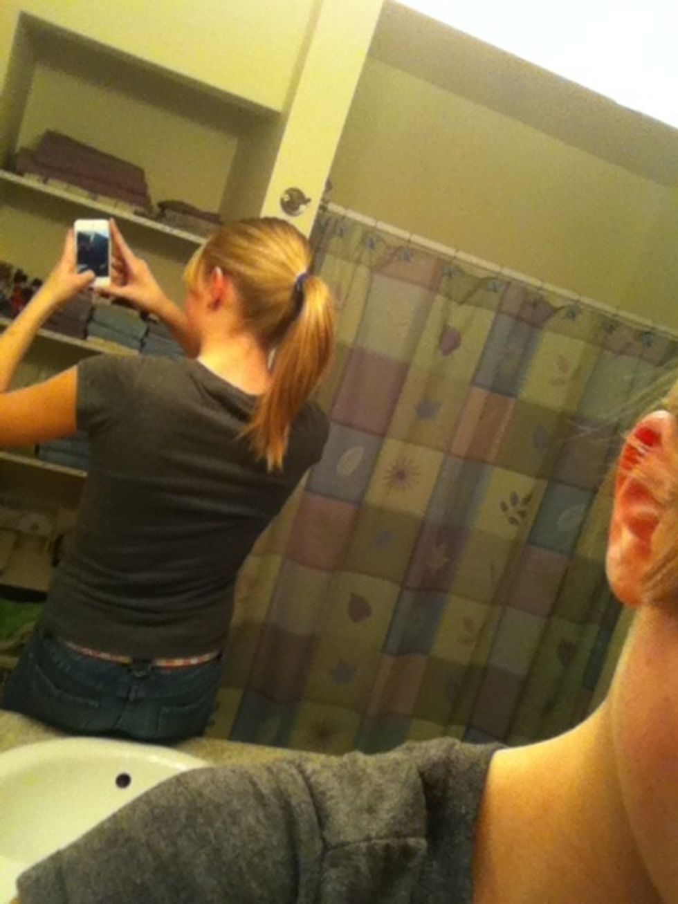 Start by putting all your hair in a pony the higher you want your bun, put your pony higher then usual.