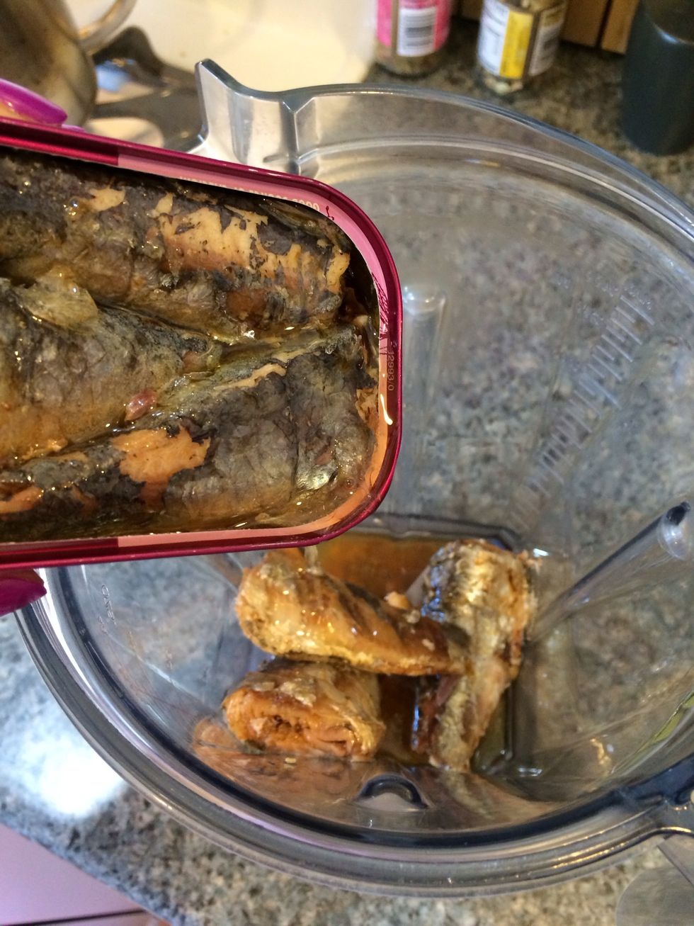 Start by putting both cans of sardines in the Vitamix/food processor/blender.