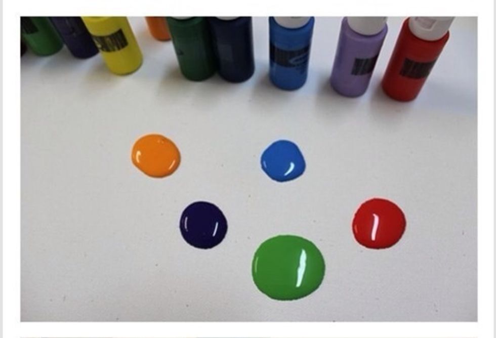 Start by putting your colors out on a paint palette or other surface. When making this I used 5 colors, it's up to you if you want more or less!
