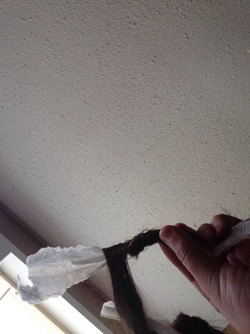 Start by rolling it up the towel