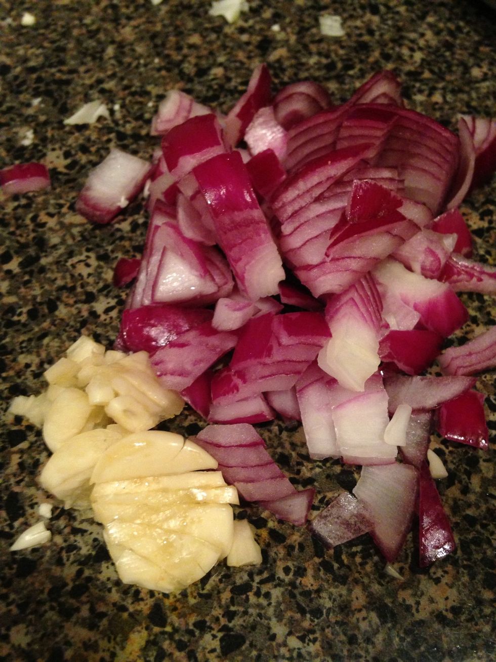 Start by rough chopping up the onion and garlic.  Tip: Allowing your garlic to sit out 10 minutes before cooking helps its nutritional properties to increase, so I always chop it up first.
