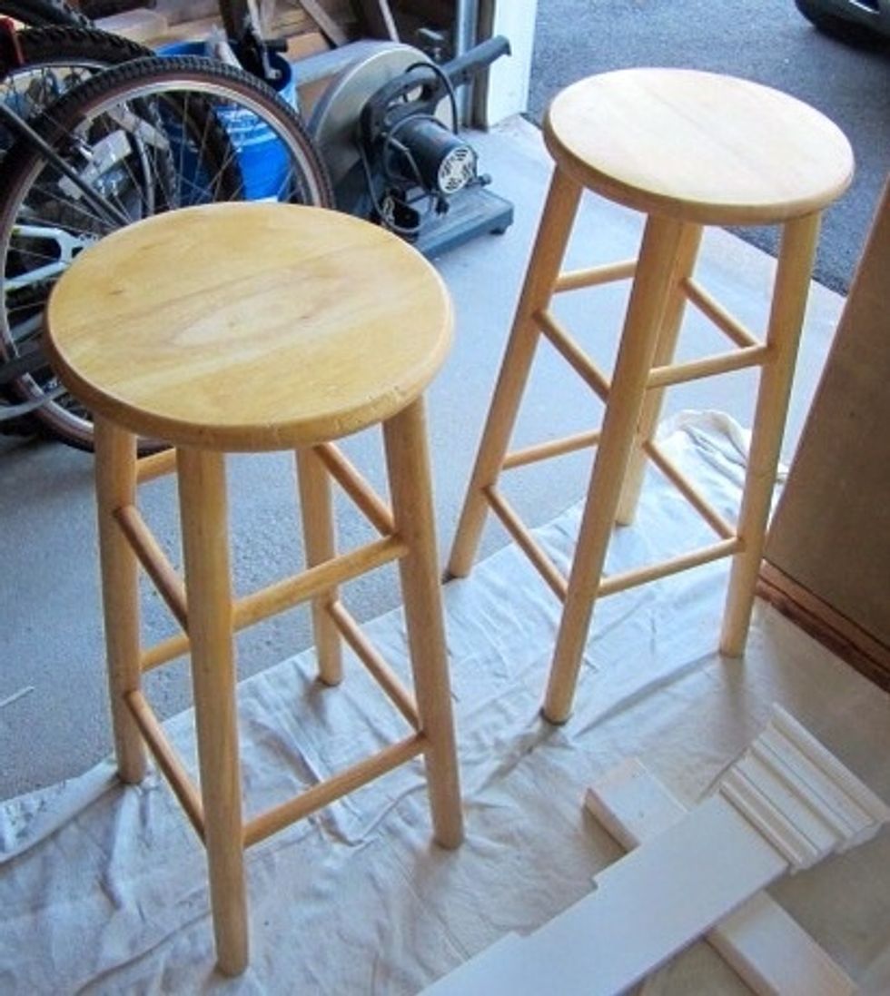 Start by sanding your bar stools. You want to scuff any shiny surface.