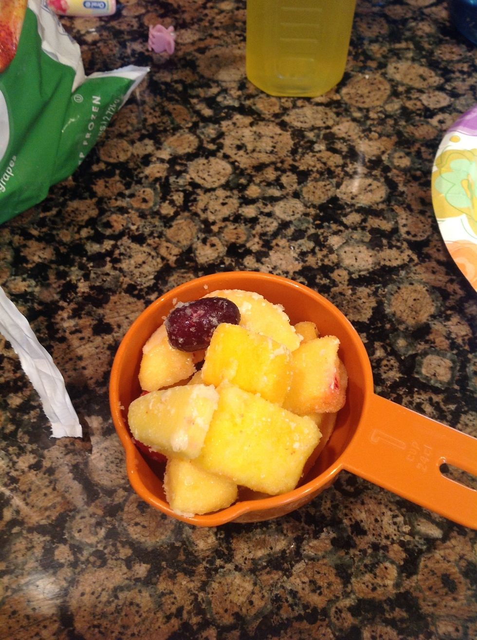 Start by scooping out a cup of frozen fruit