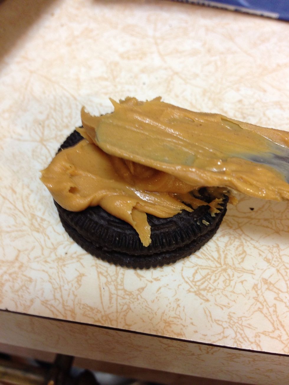 Start by smearing some P.Butter on top of 1 Oreo...