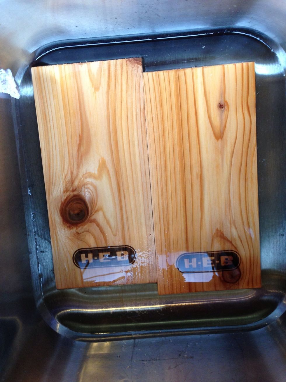 Start by soaking the cedar plank for at least 30 minutes. This will allow the planks to not catch fire while grilling. Do this step while your charcoal is getting ready.