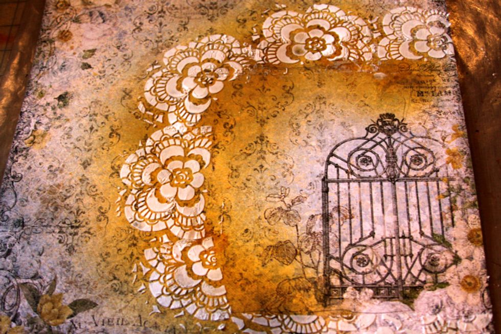 Start by spraying area where your photo will be places with Timeless Colorations. Stencil modeling past on top and dry.