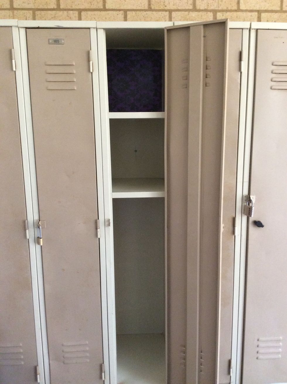 Start by sticking the wallpaper into your locker